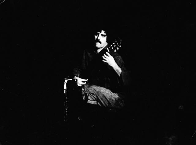 Len Handler Playing Guitar